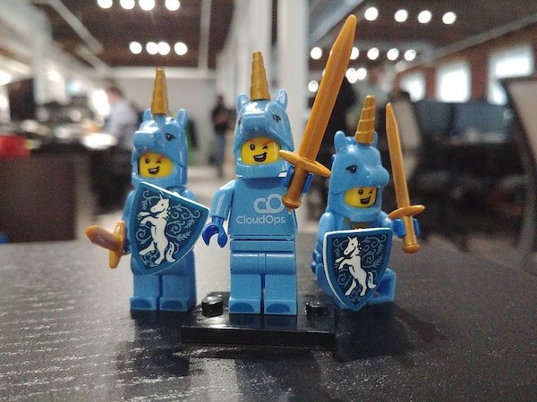 Framed picture of 3 lego men in unicorn costumes, holding swords and shields